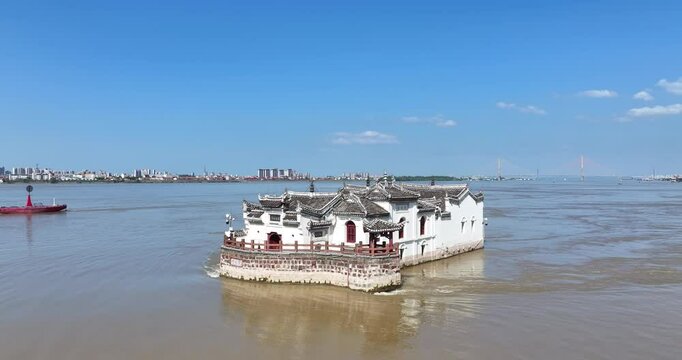 aerial video of the Guanyin pavilion on Yangtze river during the flood season, Ezhou city , Hubei province. Chinese characters on the ancient building: Chunyang palace and Guanyin pavilion