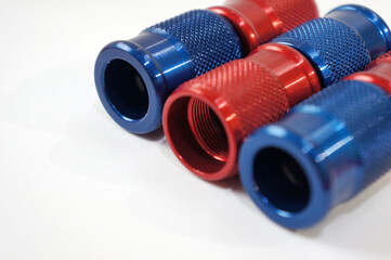 Close-Up of Red and Blue CNC Aluminum Fittings parts