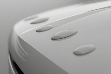 Close-up of water droplets on a sleek, modern car hood, showcasing its smooth surface and hydrophobic properties.
