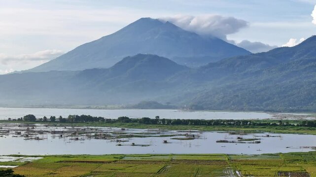 Magnificent scenery of lake with mountain background. Rawa Pening lake, Indonesia. 4K aerial drone nature landscape.