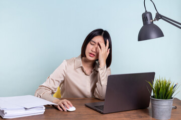 Tired, exhausted Asian woman with a laptop, problems with the project, feeling depressed, laziness...