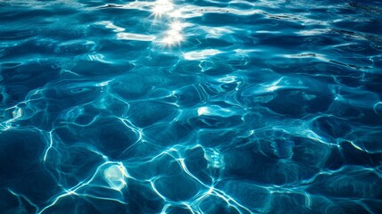 Fototapeta premium Sunlight reflecting on tranquil blue water creates a serene and calming atmosphere at the sea