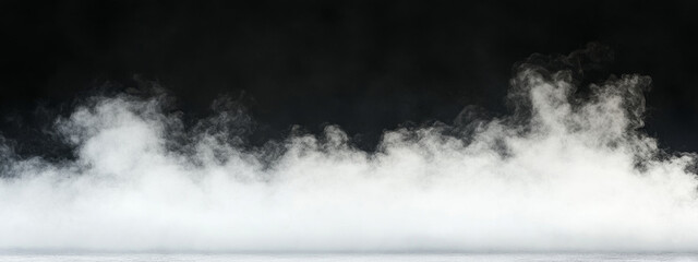 White smoke rising from ground on dark background creates mysterious atmosphere