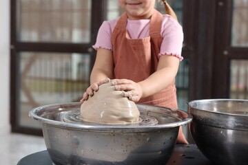 Fototapeta premium Hobby and craft. Girl making pottery indoors, closeup
