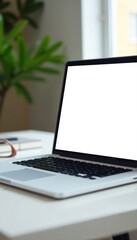 Fototapeta premium Modern white laptop, blank screen, on simple work table , electronics, table, digital