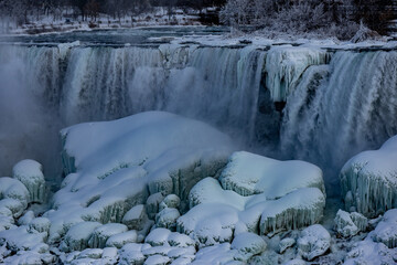 Turquoise ice on large rocks under the American Falls.