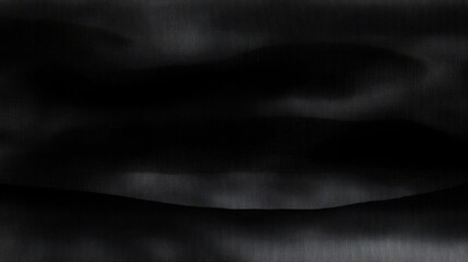 Dark Fabric Draped in Soft Waves on Black Background.