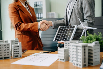 Business team people planning hand using laptop for working technology and business Net zero and...