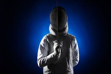 Fencer with epee on dark blue background