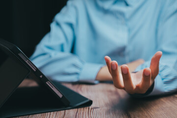 Person Gesturing with Hand While Sitting at Table with Laptop, Business concept