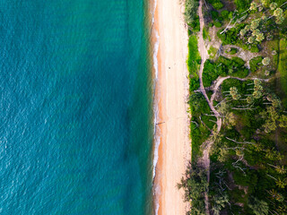 Summer seascape beautiful waves,Tropical sea water in sunny day, Top view from drone camera,Amazing ocean colorful nature background, Beautiful bright sea waves splashing on beach sand