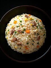 Fried rice dish on dark plate, restaurant cuisine