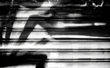 Abstract spray painting on metal door wall background. Rustic and grunge texture urban. Street and Fashion. Black and white color. Close up.