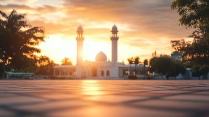 Fototapeta premium Serene Sunrise Over Mosque with Majestic Minarets and Calm Surroundings