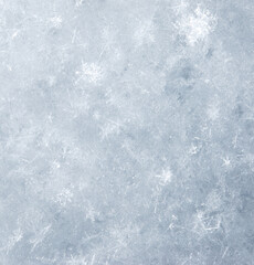 A snowy background with a few snowflakes scattered around
