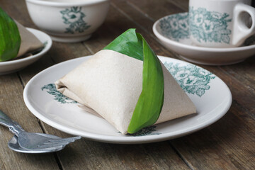 Traditional Malaysian Nasi Lemak Wrapped in Banana Leaf with Fragrant Rice and Spicy Sambal