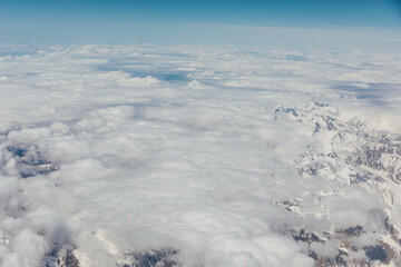 Mountain view with clouds from flying plane