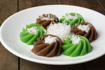 Traditional Malaysian Kuih Kaswi Pandan and Palm Sugar with Grated Coconut Topping