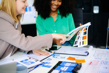  business team people meeting in office. Employee brainstorm and work as team, plan and discuss project by point on paper and tablet.