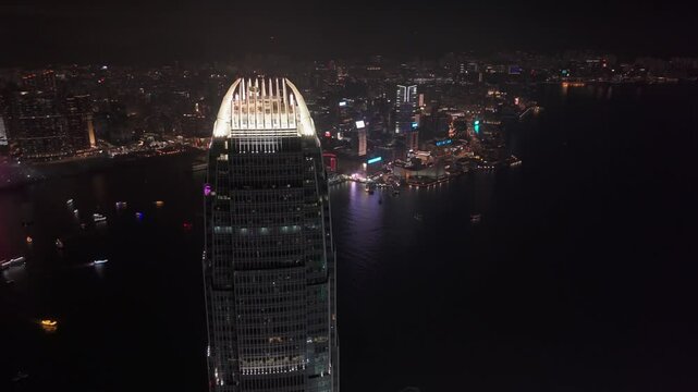 Drone shot of the IFC building at night in Hong Kong