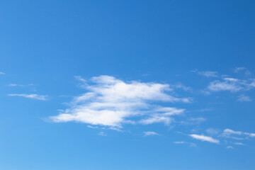 White clouds background with deep blue sky. Wallpaper with sunlight. Cloud in blue sky. Texture, pattern idea concept.