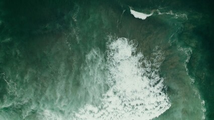 Seething seawater with foam waves, no shore, drone video