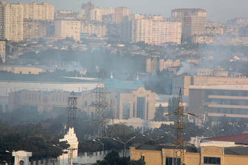 Baku, Azerbaijan. Buildings look faded due to smog and air pollution over the city. The air in the city center is polluted by restaurants, factories and cars