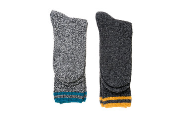 Top view of grey woolen winter socks on white background