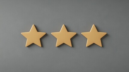 Fototapeta premium Three Yellow Star Shapes Arranged on a Gray Background for Rating or Review Concept in Minimalistic Style