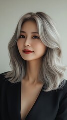 Fototapeta premium Asian Hair Model for Advertising Hair Care. Elegant woman with stylish gray hair portrait.