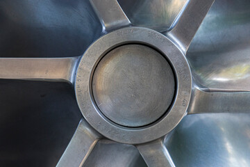 An intricate close-up view of a multi-blade industrial fan showcasing the precision and engineering behind functional design elements.