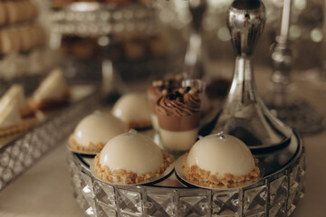 Exquisite Gourmet Desserts Set Elegantly on Crystal Platter at Event