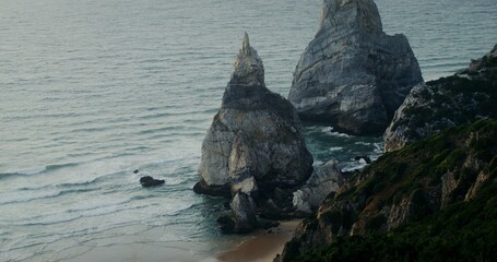 Top view of the coastline. Rocks sticking out of the water, shallow reef