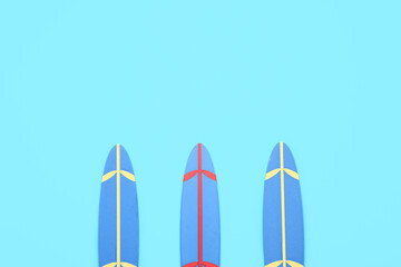 Mini surfboards on blue background