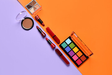 Beautiful palettes of eyeshadows and different decorative cosmetics on colorful background