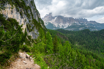 Breathtaking view of forests, mountains, and valleys in the Italian Dolomites (Dolomiti,...