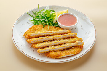 breaded chicken fillet with sauce