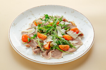 salad with meat, arugula and parmesan