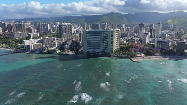 Aerial view of Waikiki Beach buildings condos and surf