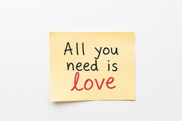 Text All you need is Love on yellow note