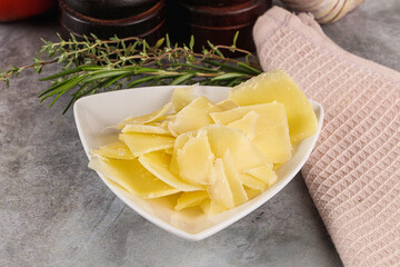 Parmesan cheese slices in the bowl
