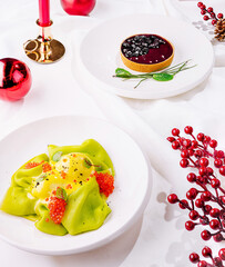 Gourmet festive dishes served on a white table setting