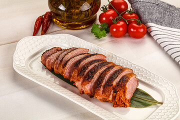 Sliced duck breast baked with cherry