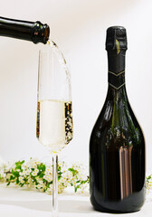 Sparkling wine being poured into a flute for celebration