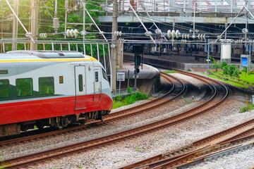 High speed electric train arrival the station to the next point, view of the turn in the city underground