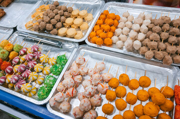 Fast food at vietnamese night market in Asia. Traditional asian street food on the counter in Vietnam in Da Nang