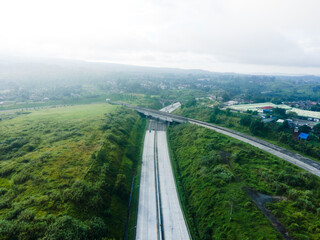 Aerial View of Highway Interchange in a Green Valley