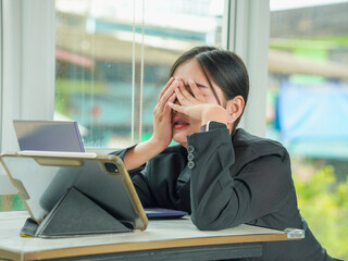 People Business. Asian businesswoman working with tired, dozing, lazy attitude in a cafe, office...