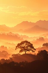 Fototapeta premium Misty mountain range background with orange sky and tree on a hill for scenic views