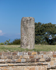 Columns and carved stone at the ancient ruins of Monte Alban in Oaxaca, Mexico.